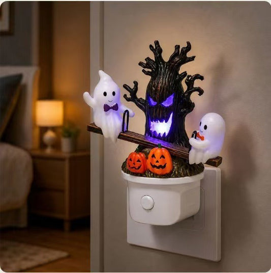 Halloween night light with swinging ghost design