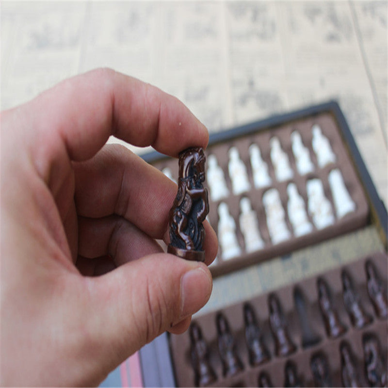 Detailed close‑up of the sculpted horse piece from the antique Chinese chess set, capturing the intricate resin detailing.

