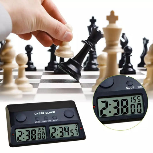 Top-down view of chess tournament timer showing dual turn buttons