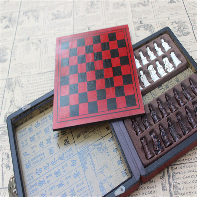 Open vintage chess set box displaying the interior compartments that hold each resin chess piece.