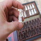 Close‑up of a pawn from the vintage Chinese chess set showing its 3.5 cm height and 2 cm round base.