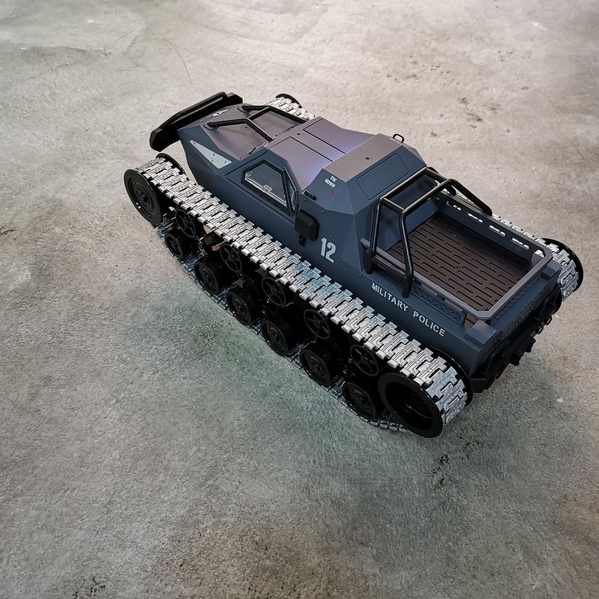 Model of a military vehicle on a concrete surface
