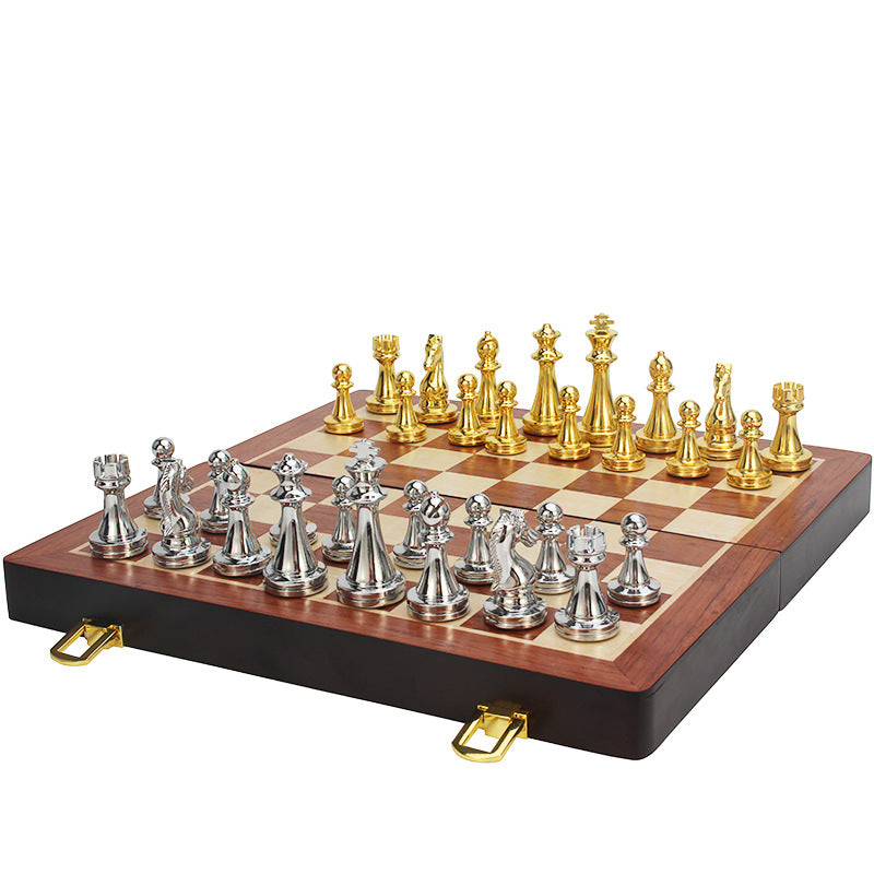 Fully folded board lying flat with the metal pieces neatly stacked beside it for compact storage
