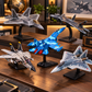Blue fighter plane model beside a PS5 console and controller