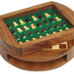 Pieces of the magnetic wooden chess set placed aboved the main playing board in their compact stoarge box