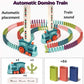 Toy domino train automatically dispensing dominoes at 1.5 cm intervals