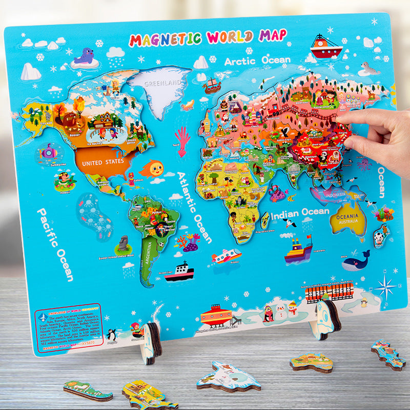 Colorful magnetic world map puzzle with a hand interacting with it on a wooden surface.