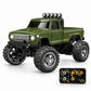 An olive green mini RC monster truck with black off-road tires, a black roll bar with four auxiliary lights, and a black remote control controller shown in the bottom right corner, set against a plain white background.