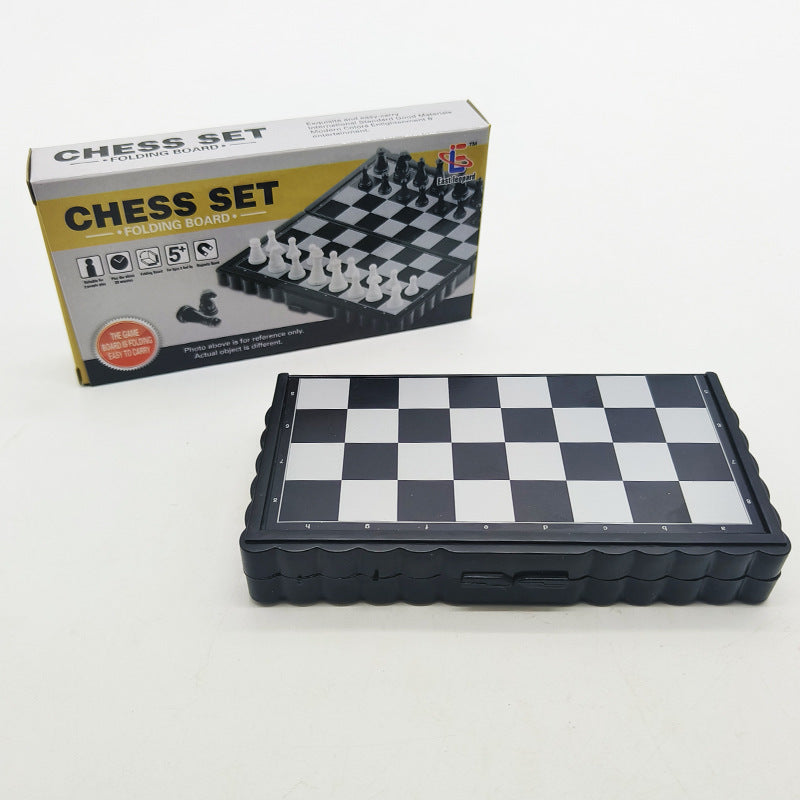Side profile of the portable chess set highlighting the central folding hinge mechanism
