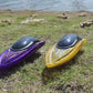 Yellow radio control boat side view